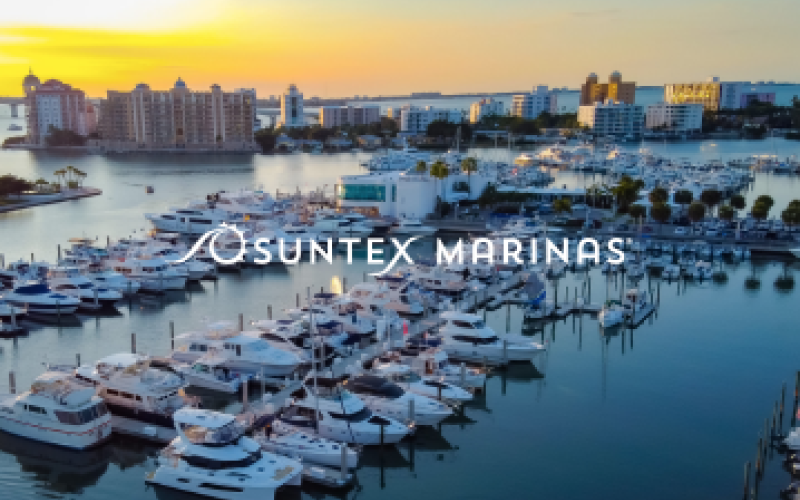 Sunset on boats in the water with text that says Suntex Marina
