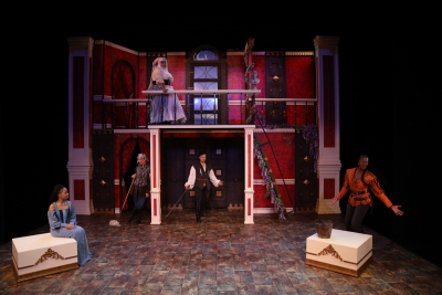 Image of actors on a stage performing Romeo and Juliet