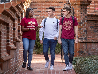 Three FSU students walking and talking