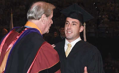 Max Rieves shaking FSU President John Thrasher's hand at graduation