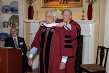 President Thrasher bestowing the honorary stole on Dr. Hold